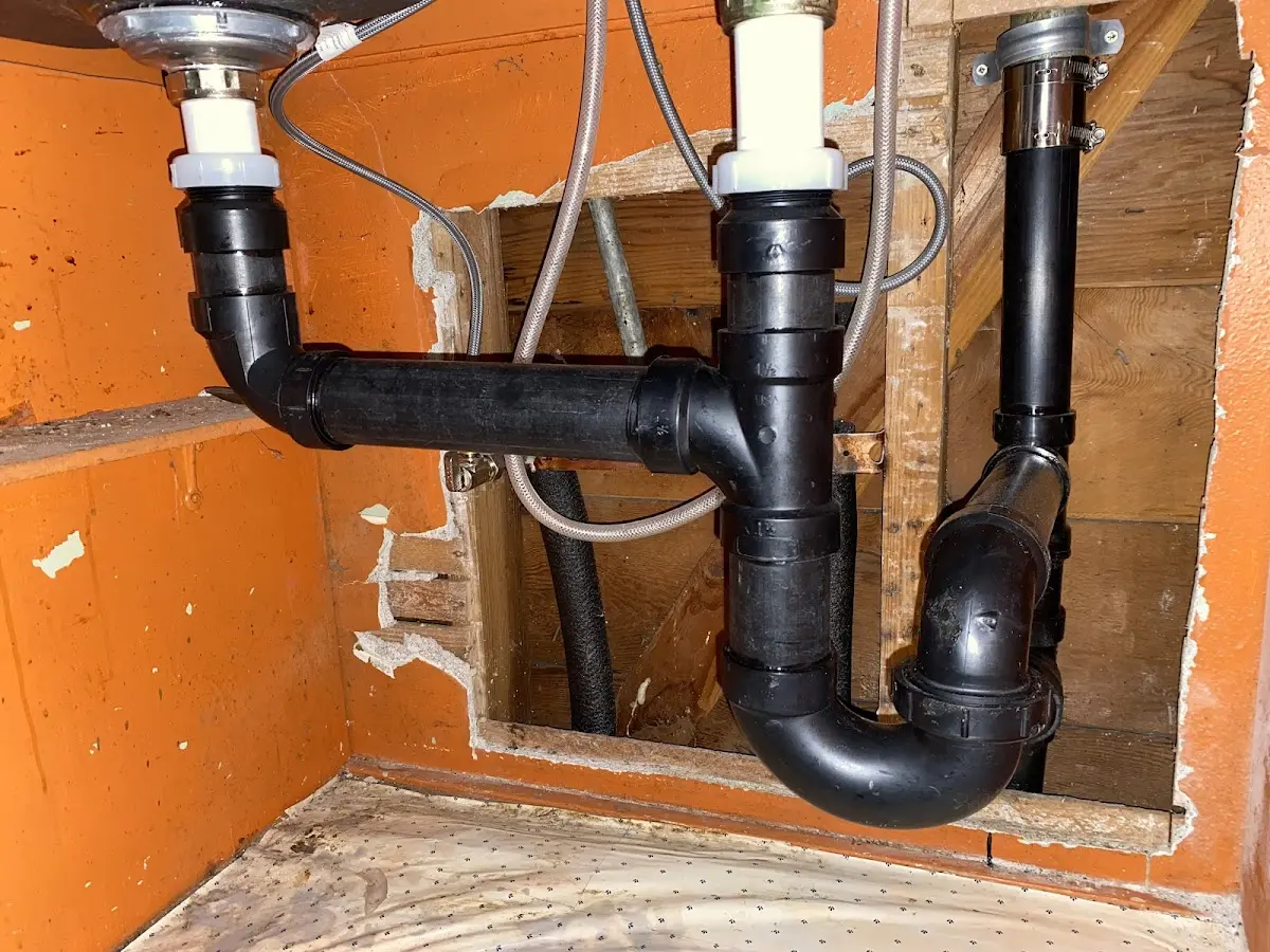 Professional Garbage Disposal Repair equipment and tools on the job in Millburn